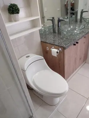 a bathroom with a toilet and a sink at Bella vista al mar de Lima - Miraflores in Lima