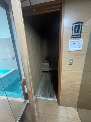 an elevator in a building with a swimming pool at Gorgeous 2BDRM with A/C - Miraflores in Lima