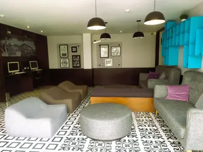 a living room with a couch and chairs and a table at Refugio en Barranco, Private Apartament in Barranco in Lima