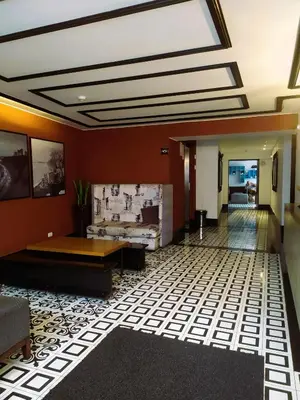 a lobby with red walls and a skylight at Refugio en Barranco, Private Apartament in Barranco in Lima