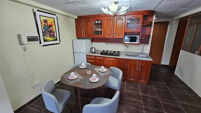 a kitchen with a table and chairs in a room at Casa Independiente cerca al Centro en Segundo Piso - Los Profesionales in Cusco