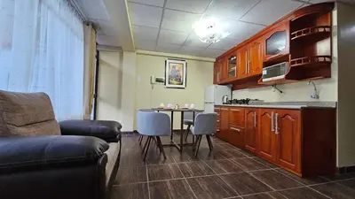 a kitchen with a table and chairs in a room at Casa Independiente cerca al Centro en Segundo Piso - Los Profesionales in Cusco