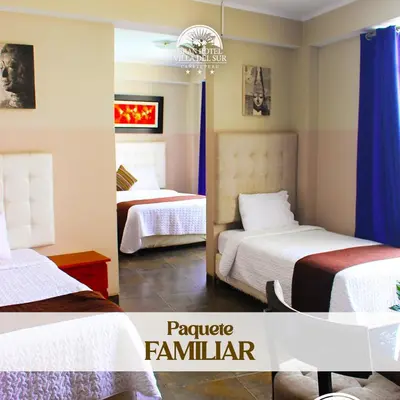 a hotel room with two beds with blue curtains at GRAN HOTEL VILLA DEL SUR in San Vicente de Cañete