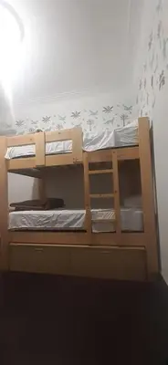 a bunk bed with two bunk beds in a room at Quinoa Backpackers Hostel in Lima