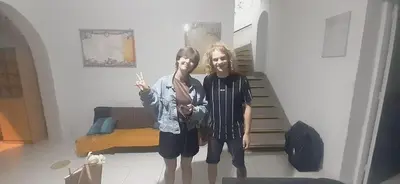 two young children are standing in a room at Quinoa Backpackers Hostel in Lima