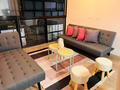 a living room with a couch and a table at MONTERRICO POLO APARTS #13 - DPTO 2 dorm - Frente Embajada USA in Lima