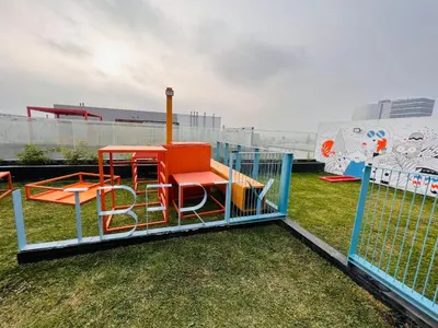 a playground with a play set on the grass at MONTERRICO POLO APARTS #13 - DPTO 2 dorm - Frente Embajada USA in Lima