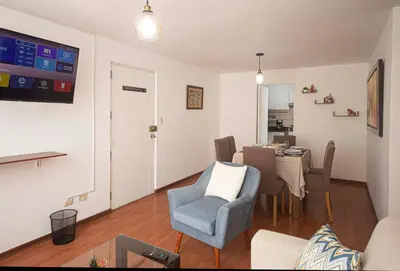 a living room with a table and a dining room at Runawasi Apartments - José Gonzales 3BDR, near to Larcomar in Lima