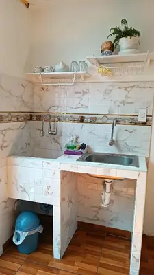a kitchen with a sink and a counter at Mini Apartamento Vista Verde in Lima
