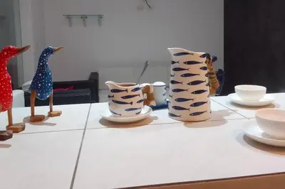 a group of vases sitting on top of a table at Departamento en playa Chocaya. Disfruta del mar, la piscina y la tranquilidad. in Asia