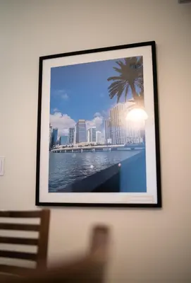 a picture of a city with a palm tree on a wall at Beautiful 2BR in Miraflores in Lima