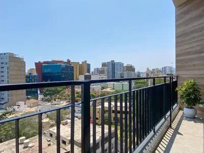 a balcony with a view of a city at Los Pinos by Wynwood House in Lima