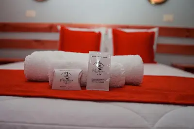 a pile of toilet paper on top of a bed at El Peregrino Apart Hotel in Abancay