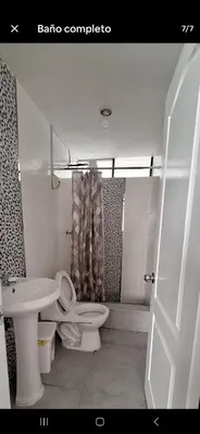 a bathroom with a toilet and a sink and a shower at Lucia's apartmens in Cusco