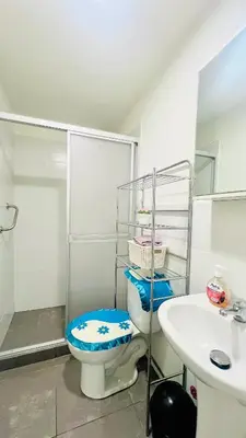 a bathroom with a toilet and a sink at Pacific Apartamento Surco in Lima