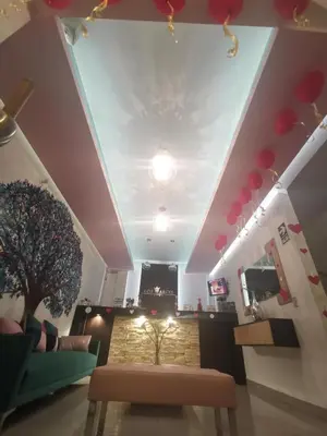 a living room with a couch and a table at LOS ARCES HOTEL in Lima