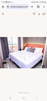 a hotel room with a bed and a window at LOS ARCES HOTEL in Lima