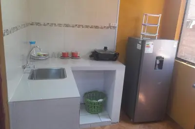 a small kitchen with a sink and a refrigerator at 202 Comfy Apt WiFi kitchen SmartTV Central at Callao in Lima