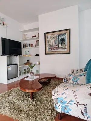 a living room with a coffee table and a couch at Hotel Los Palomos in Lunahuaná