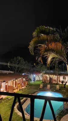 a resort with a swimming pool at night at La Fortaleza del Inca in Lunahuaná