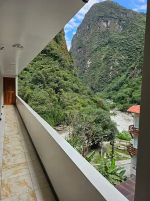 a balcony with a view of a mountain at Hotel Horizonte in Machu Picchu