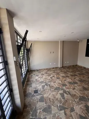 an empty room with a staircase and a floor at Palmeras house in Ica