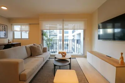a living room with a couch and a tv at Soul by Wynwood House in Lima
