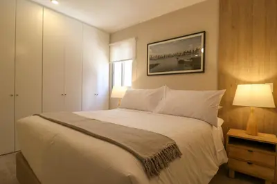 a bedroom with a large white bed and a window at Soul by Wynwood House in Lima