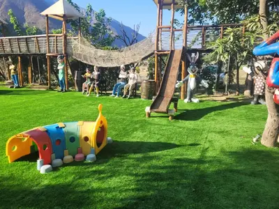 a playground with a slide and a play structure at HOTEL RUSTICA SANTA EULALIA in Lima
