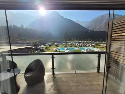 a balcony with a view of a golf course at HOTEL RUSTICA SANTA EULALIA in Lima