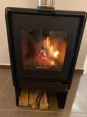 a stove with a fire inside of it at Hotel and Country House Valle Sagrado de los Incas in Huaran