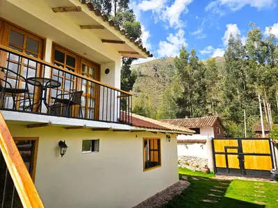 a view of a house with a balcony at Hotel and Country House Valle Sagrado de los Incas in Huaran