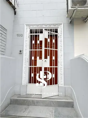 a door with a metal gate on a building at Casa Águila y Cóndor Miraflores in Lima