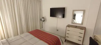 a bedroom with a bed and a dresser and a mirror at Sumaq Home Lima Airport in Lima