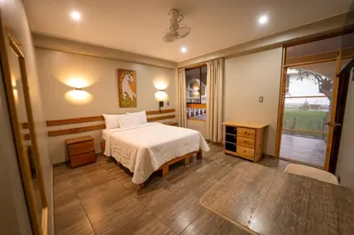 a hotel room with a bed and a window at Hotel Fundo San Rafael in Nazca