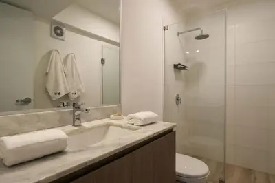 a bathroom with a sink and a toilet and a shower at One By Wynwood House in Lima
