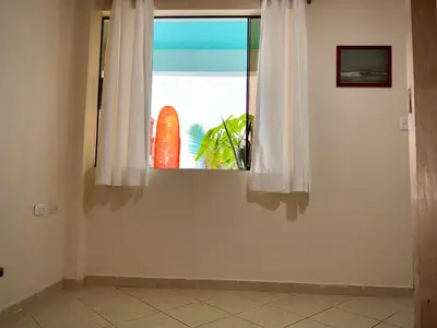 a window in a room with a view of the ocean at Casa mar surfhouse in Punta Hermosa