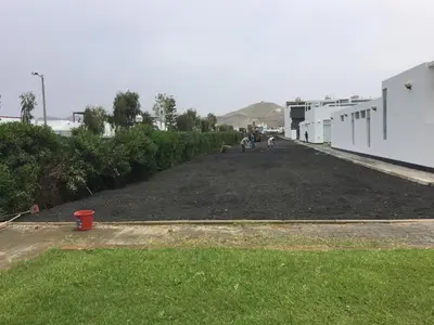 a dirt driveway with people and a dog on it at Casa de Playa frente al mar en Chocalla, Asia in Asia