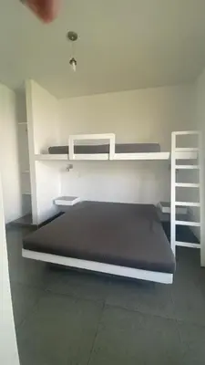 a bedroom with two bunk beds in a room at Casa de Playa frente al mar en Chocalla, Asia in Asia