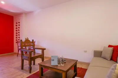 a living room with a couch and a table at Casa Muru By Wynwood House in Cusco