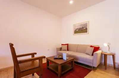 a living room with a couch and a table at Casa Muru By Wynwood House in Cusco