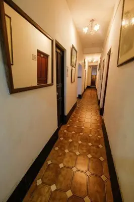 a hallway with a tile floor in a building at Residencial San Felipe in Lima