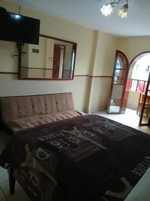 a bedroom with a bed with a sign on it at Residencial San Felipe in Lima