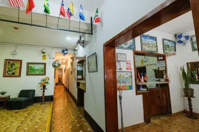 a hallway with a room with flags on the wall at Residencial San Felipe in Lima