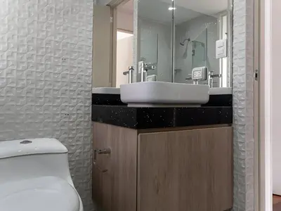 a bathroom with a sink and a toilet at Acogedor 2BR Center Miraflores - Balta in Lima