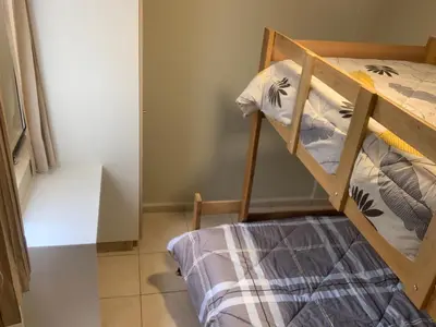 a small bedroom with a bunk bed in a room at Apartamento LA ALBORADA para 7 con cochera in Huancayo