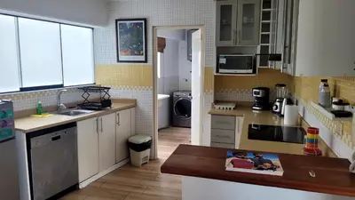 a kitchen with a sink and a counter top at Acogedor 2BR Miraflores - Tovar in Lima