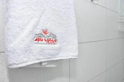 a towel hanging on a wall in a bathroom at Apu House Monoambiente in Cusco