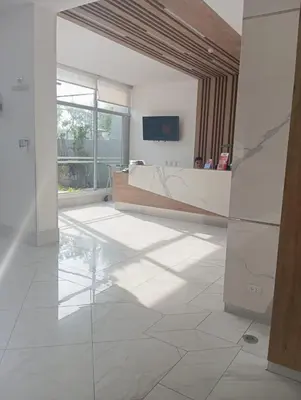 a large white room with a tub and a large window at Departamento en el edificio más alto del Perú, a 10 min de Plaza de Armas in Lima