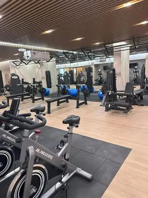 a gym with several treadmills and exercise bikes at 1Br AC San Isidro Apartment in Lima